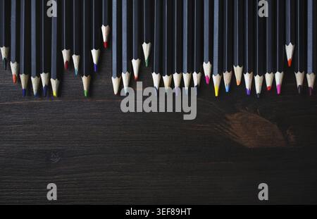 Color pencils on wood table background. Color pencils for drawing. Flat lay Stock Photo