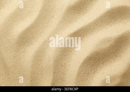 Wavy sand background for summer designs. Flat lay, top view Stock Photo