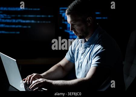 Malware hacker develops malicious software. Malware hacker infects computer network. Malware hacker bypasses security system. Malware hacker spreads Stock Photo