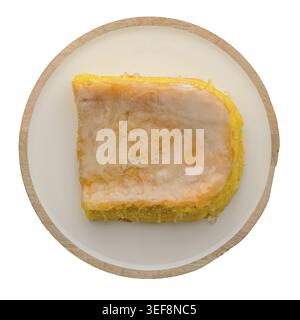 PArt of portuguese sponge cake bolinhol from Vizela on round plate, top view isolated on white background Stock Photo