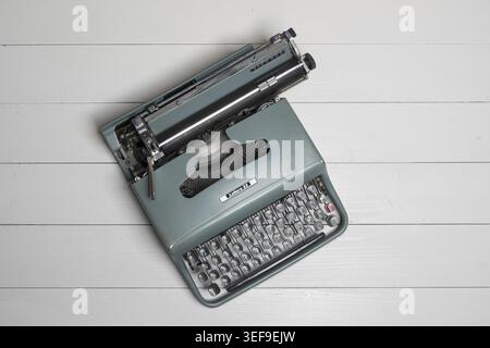 An old typewriter on a wooden table Stock Photo