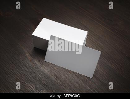 Blank business cards on wooden background. Mockup for branding identity Stock Photo