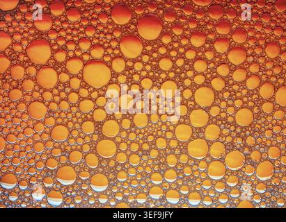 Orange bubbles background. Foam bubbles macro texture Stock Photo
