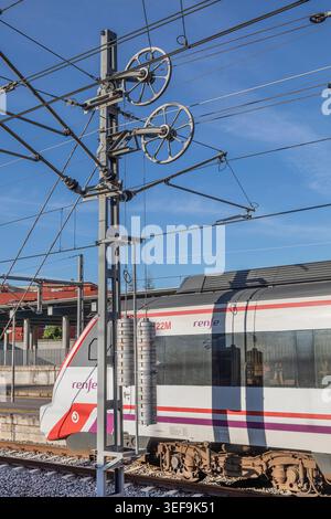 Tension weights for overhead electic railway cables. Stock Photo