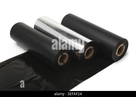 Black roll wax ribbon for thermal transfer printer in core on white background Stock Photo