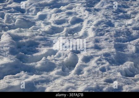 Sunny bright snow texture background, natural white snow. Selective focus Stock Photo