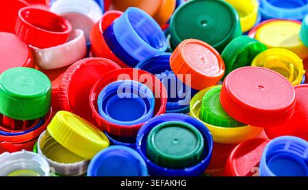 Different sorts of colorful plastic bottle caps. Recycling. Stock Photo