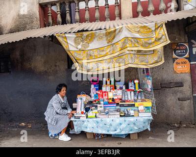 Street vendor sells school supplies in Antanavarino Madagascar during busy day Stock Photo