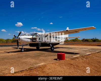 Charter flight plane parked on tarmac at Anjajavy Private Reserve in Madagascar under clear skies Stock Photo