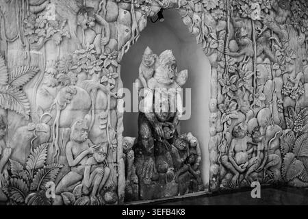 Black and white Balinese monkey relief wall, Bali, Indonesia Stock Photo