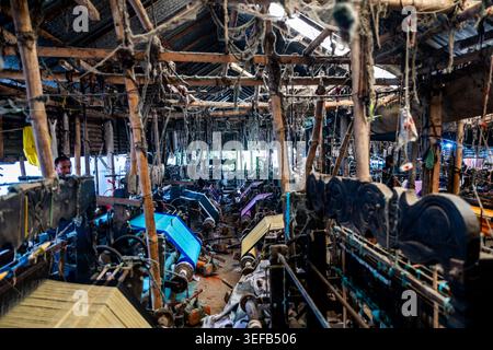 Looming factory operates in Araihazar village with many machines working during day Stock Photo