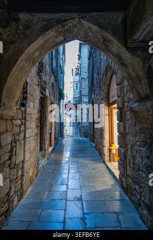 Exploring the narrow streets of Diocletian's Palace in Split, Croatia during the day Stock Photo