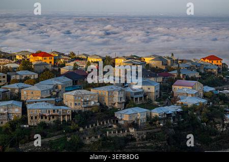 View over the houses in Kubachi town with clouds below in Dagestan Russia Stock Photo