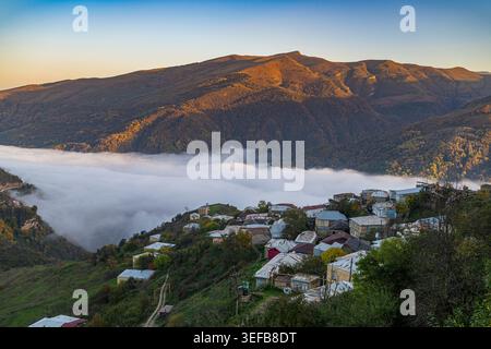 Overlooking the Silver town of Kubachi in Dagestan during sunrise with mist over the valley Stock Photo