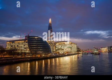 Night view of City Hall and The Shard along the River Thames in London, United Kingdom Stock Photo