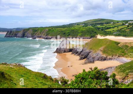 View of Pobbles Bay beach and Three Cliffs Bay on the Gower Peninsula in Swansea, United Kingdom Stock Photo