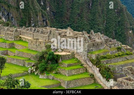 Inca site of Machu Picchu shows ancient architecture and terraced fields in Peru Stock Photo