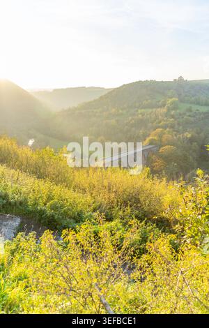 View of Monsal Dale and viaduct during sunset in autumn over rolling hills in Bakewell, United Kingdom Stock Photo