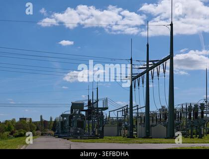 Energy Industry: High and medium voltage substation on a sunny spring afternoon Stock Photo