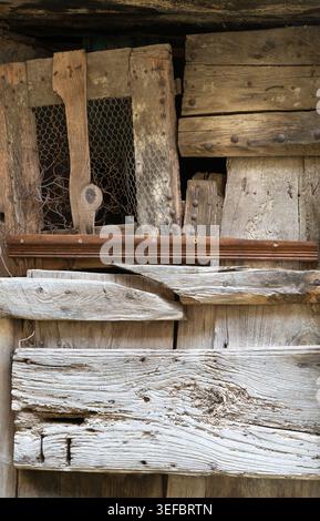 Chicken coop door made from recycled materials Stock Photo