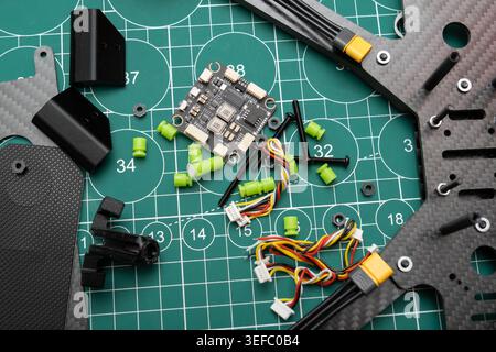 An assembled sport FPV drone body with a stack flight controller and DIY U ready for flight . Close-up Stock Photo