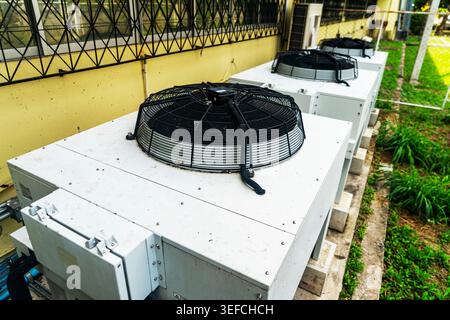 Modern outdoor air conditioning units designed for efficient climate control and ventilation in commercial or industrial settings, durable weatherproo Stock Photo