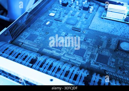 Detailed view of a computer circuit board showcasing various electronic components, including chips, microprocessors, and circuitry on a technological Stock Photo