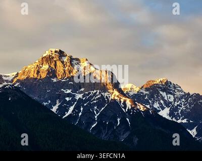 Mystical Mountain Sunrise over Piz Ajüz and Piz Lischana in the Engadine Swiss Alps, Switzerland Stock Photo