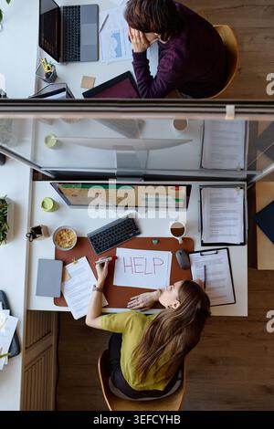 Vertical of Adult Office Employees Working under Stress in Burnout Concept Stock Photo