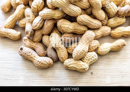 Close-up with a pile of peanuts in their shells Stock Photo