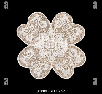 Light beige embroidered flower applique isolated on black background. Decorative textile element ideal for design mockup, branding, wedding stationery Stock Photo