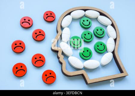 Mental health recovery concept with pills and emotions. Positive mood treatment. Stock Photo