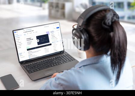 Coding course platform displayed on laptop during online study session, featuring programming lessons, developer dashboard and digital education inter Stock Photo