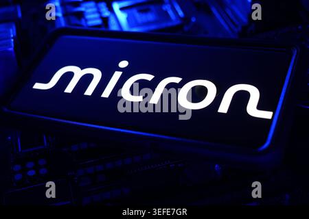 Micron Technology Semiconductor Memory Chip Company Logo Displayed On Digital Screen With AI Driven Financial Stock Market Chart Background Stock Photo