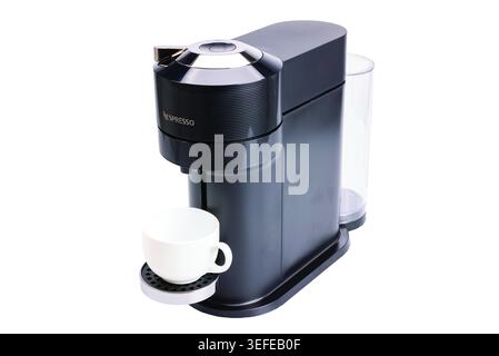 Close-up view of Nespresso coffee machine with white cup isolated on white background. Sweden. Stock Photo