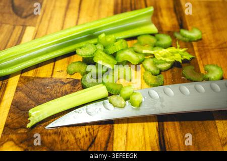 Cutted celery on a wooden board. Home made cooking. Stock Photo