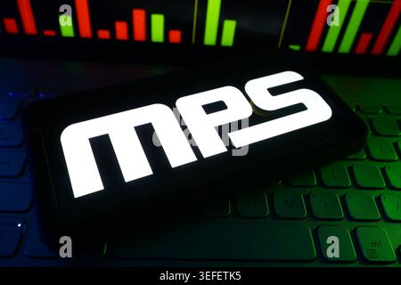MPS Monolithic Power Systems Semiconductor Technology Company Logo Displayed On Digital Screen With Financial Stock Market Performance Chart Stock Photo