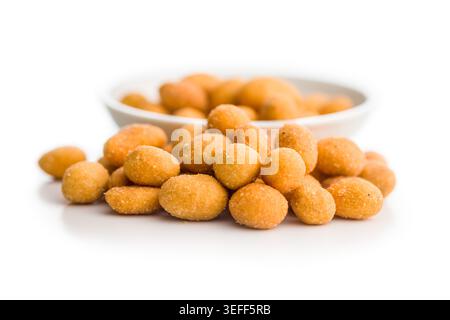 Crunchy golden coated peanuts piled on a clean white background, showing textured, salted snack pieces ideal for party bowls, bar snacks, casual gathe Stock Photo