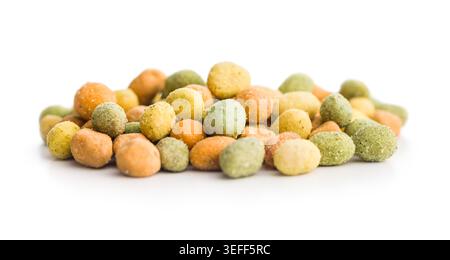 Colorful coated peanuts and crunchy wasabi-style peas piled on a white background, showing textured seasoning, savory snack appeal and bite-sized part Stock Photo
