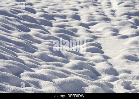 The texture of the small snowdrifts on the ground Stock Photo