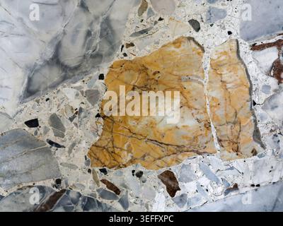Golden Marble with Dramatic Yellow Fragments Stock Photo