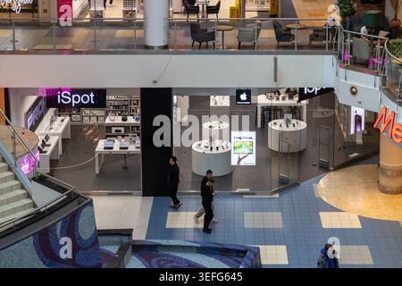 Warsaw, Poland - April 13, 2026: A high angle view of an iSpot retail shop displays laptops and mobile devices, highlighting a modern consumer electro Stock Photo