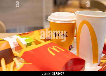 Warsaw, Poland - April 13, 2026: McDonald's food tray featuring McCafe coffee, crispy french fries, and a cold drink, highlighting a classic fast food Stock Photo