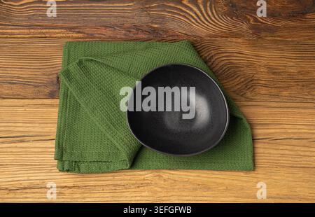 Empty Bowl Mockup, Black Plate on Wooden Table Top View with Copy Space for Text, Rustical Kitchen Mock Up, Empty Bowl with Cloth Napkin Fabric Stock Photo