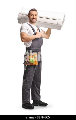 Technician carrying indoor air conditioning unit and pointing isolated on white background Stock Photo