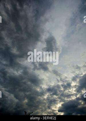 Dark storm clouds moving across the sky, indicating a change in weather and coming rain Stock Photo
