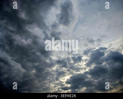 Dark storm clouds moving across the sky, indicating a change in weather and coming rain Stock Photo