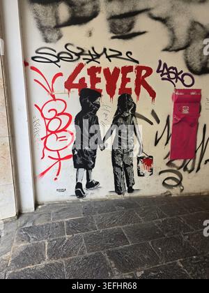 Banksy style graffiti of two children with one holding a knife. Stop ...