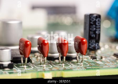 Close-up view of a circuit board with electronic components and connectors. Detailed macro image of modern technology hardware used in computers, comm Stock Photo