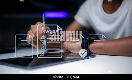 Person hand using digital tablet for E-invoice management and checking billing documents. Business professional working on online accounting. Paperles Stock Photo